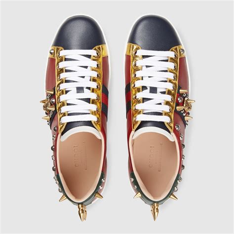 gucci ace studded sneakers.